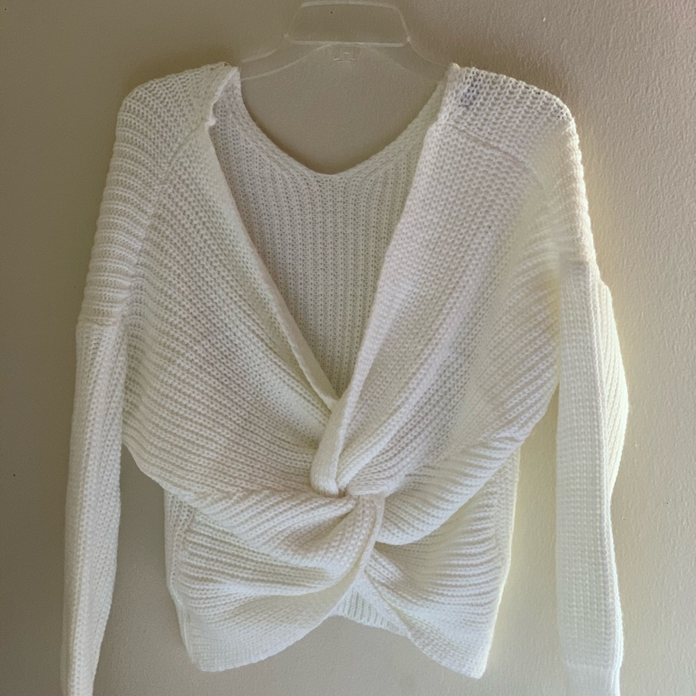 White wool oversized sweater with twisted back.